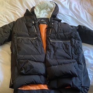 Never worn Orolay winter jacket with fleece hood. Size XL